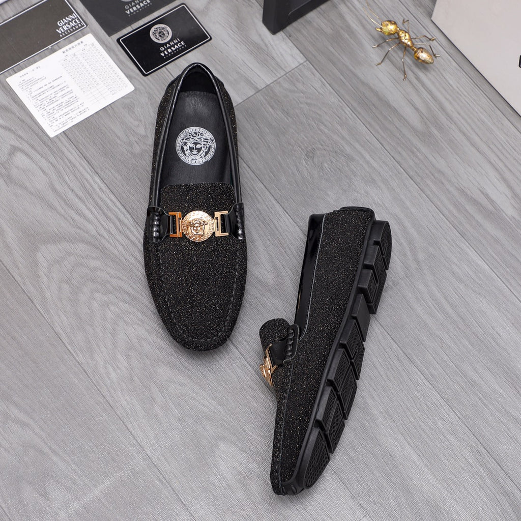 Versace black glitter loafers with gold buckle and crest emblem, front and side