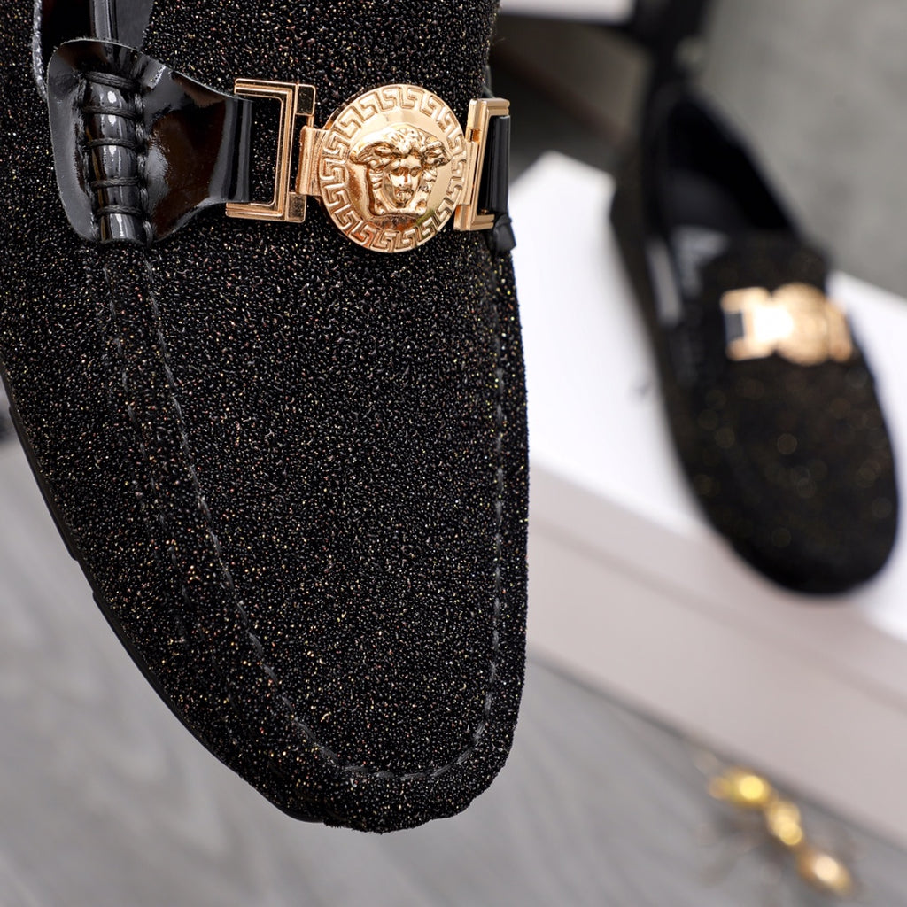 Versace black glitter loafer front with gold buckle and crest emblem close-up