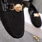 Versace black glitter loafer front with gold buckle and crest emblem close-up