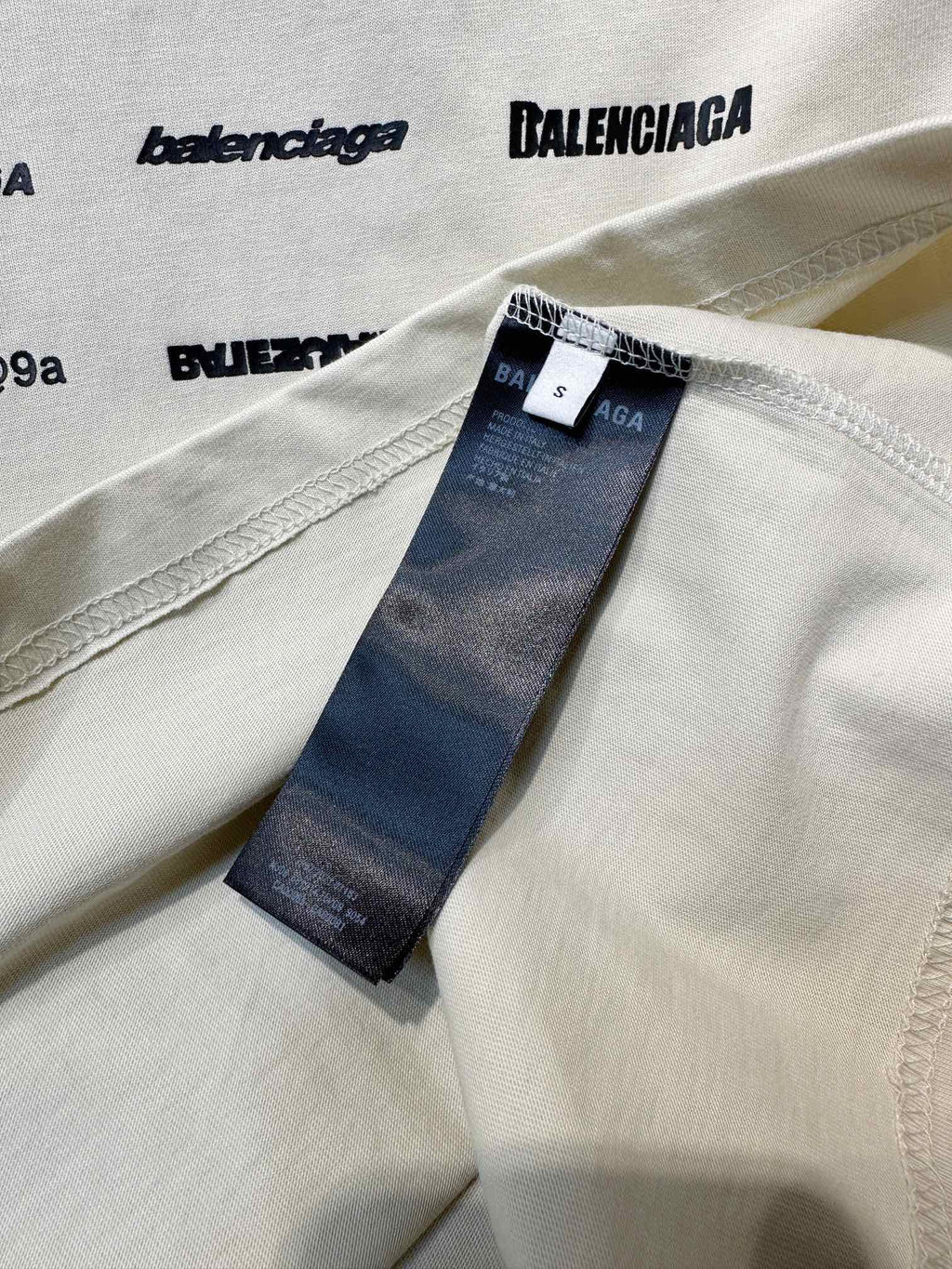 White T-shirt with Balenciaga neck label and blue inner brand tag