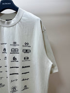Balenciaga white T-shirt sleeve with black logo graphics near the shoulder