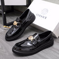 Versace patent leather loafers with gold buckle and chunky black platform sole