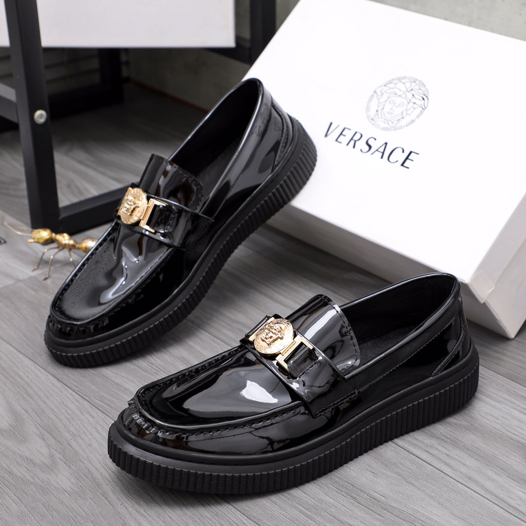 Versace patent leather loafers with gold buckle and chunky black platform sole