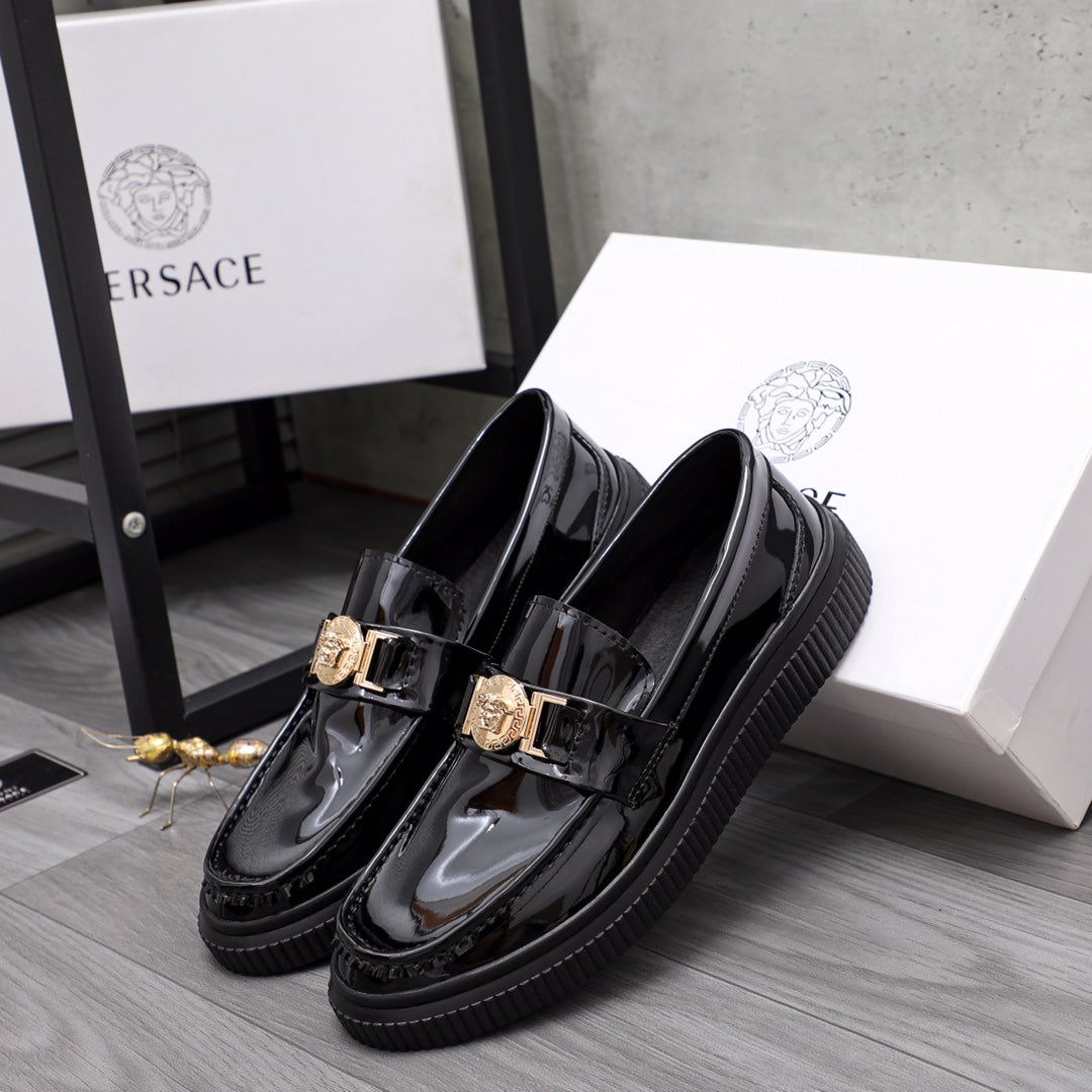 Pair of Versace glossy loafers with double gold-tone buckles and platform sole