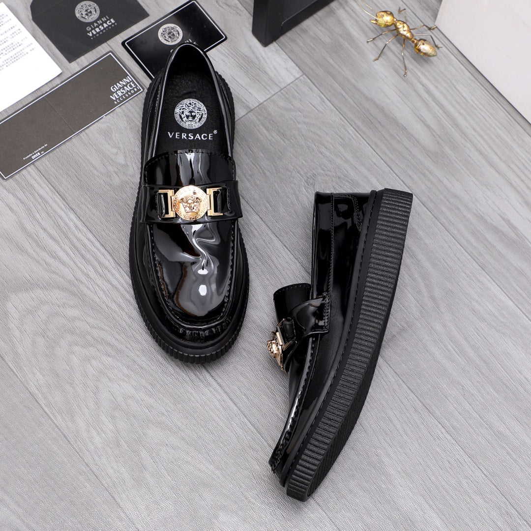 Versace patent loafers with gold buckle hardware and ribbed tread platform sole
