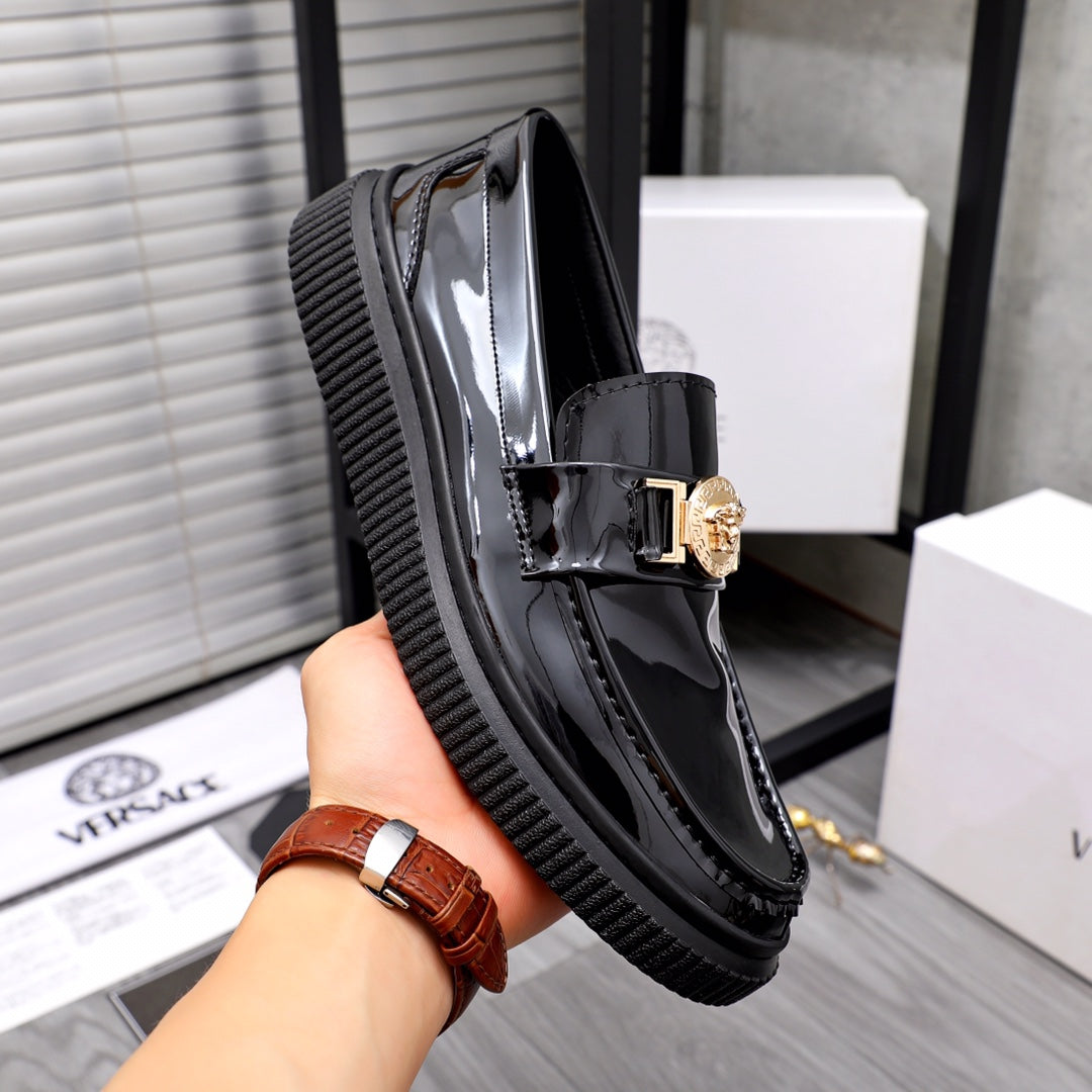 Versace patent loafers, black with gold-tone buckle detail and textured platform