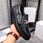 Versace luxury black patent loafers with gold buckle and chunky ribbed sole