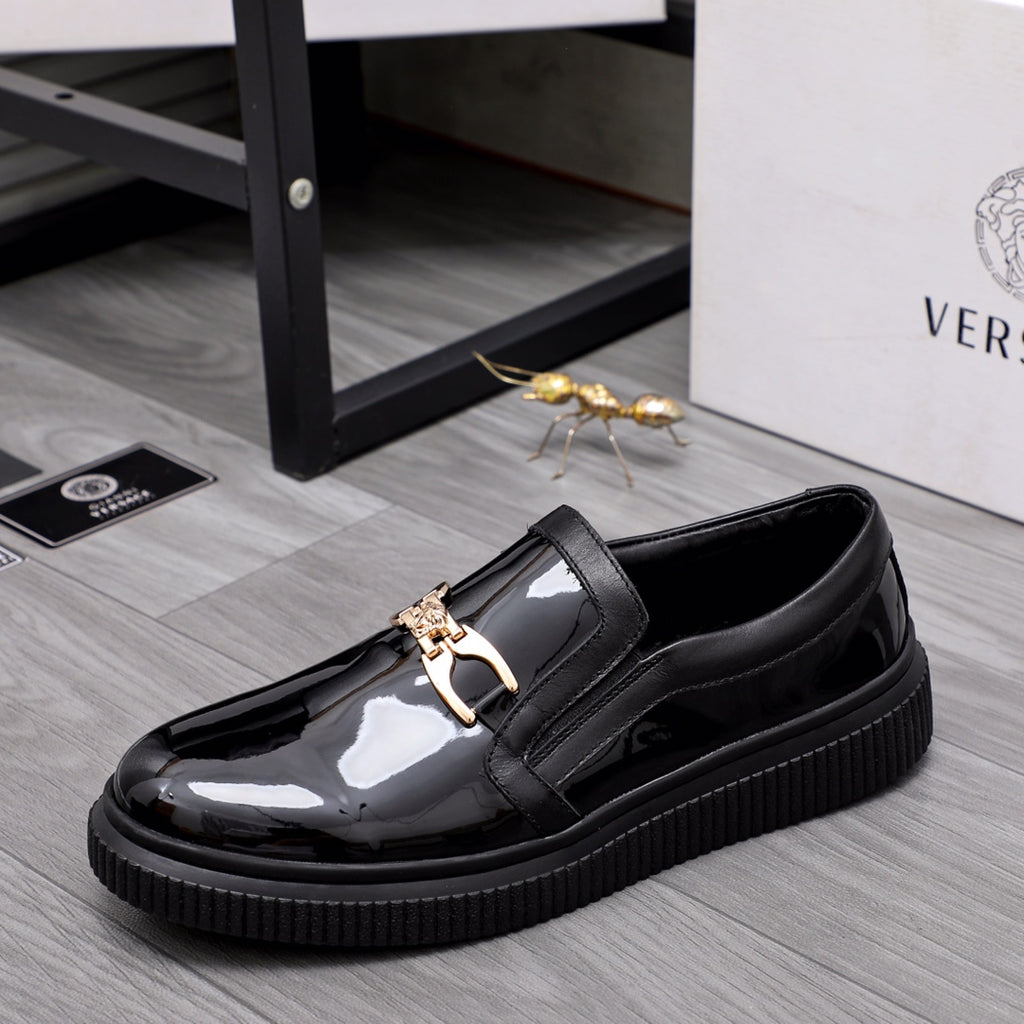 Versace luxury black patent slip-on loafers with gold buckle and thick sole