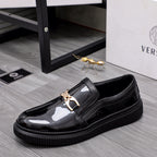 Versace luxury black patent slip-on loafers with gold buckle and thick sole