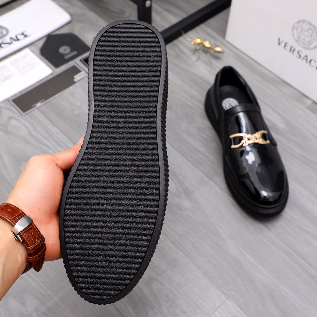 Versace luxury loafer outsole with ribbed tread, shown with black upper