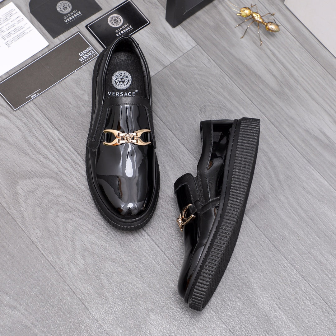 Versace luxury black patent loafers with gold buckle, front and side view
