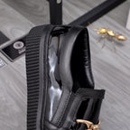 Versace luxury black patent loafers with wide strap and gold buckle