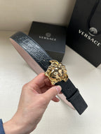 Versace belt, dark leather with croc texture and gold Medusa buckle.