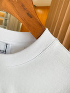 White T-shirt neckline with ribbed crew collar and smooth knit collar band.