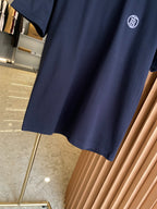 Navy crew-neck short-sleeve T-shirt on hanger, logo at chest.