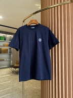 Navy short-sleeve crew-neck T-shirt with small white logo on chest.
