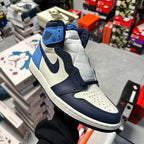 Air Jordan 1 high-top sneaker with navy laces, light blue, and white side panels