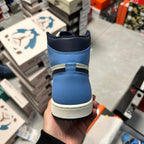 Air Jordan 1 high-top sneaker heel with navy collar and light blue upper