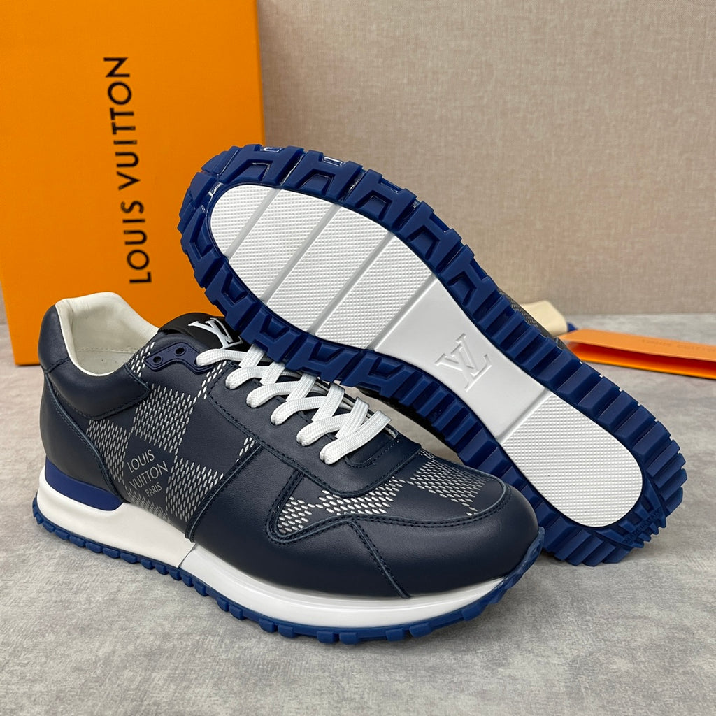 Navy Louis Vuitton low-top sneakers with white laces and patterned panels, rugged blue outsole