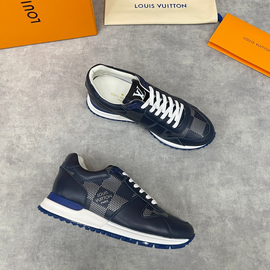 Navy Louis Vuitton low-top sneakers with white laces, diamond-pattern sides and blue sole