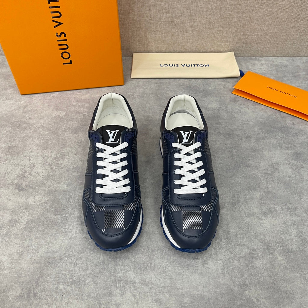 Navy Louis Vuitton low-top sneakers pair with white laces, patterned sides, blue sole