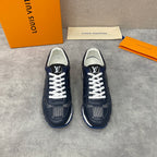 Navy Louis Vuitton low-top sneakers pair with white laces, patterned sides, blue sole