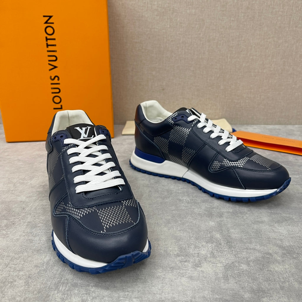 Navy Louis Vuitton low-top sneakers with white laces, textured diamond panels and blue sole