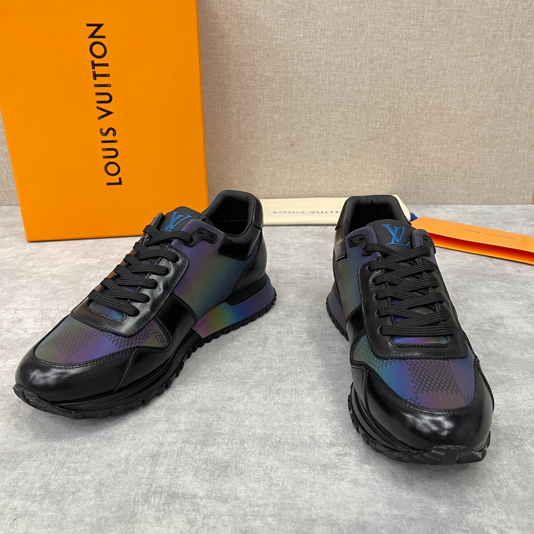 Black low-top sneakers with iridescent multicolor panels and chunky tread sole.
