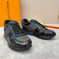 Black low-top sneakers with iridescent multicolor panels and lace-up front.