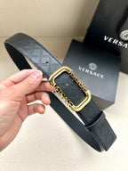 Versace belt in dark gray with embossed logo pattern and gold-tone square buckle.