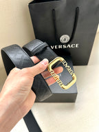 Versace belt with dark embossed pattern and gold-tone square buckle detail.