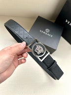 Versace belt with dark patterned strap and silver-tone square buckle with medallion