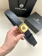 Versace belt, dark patterned leather strap with gold lion medallion buckle