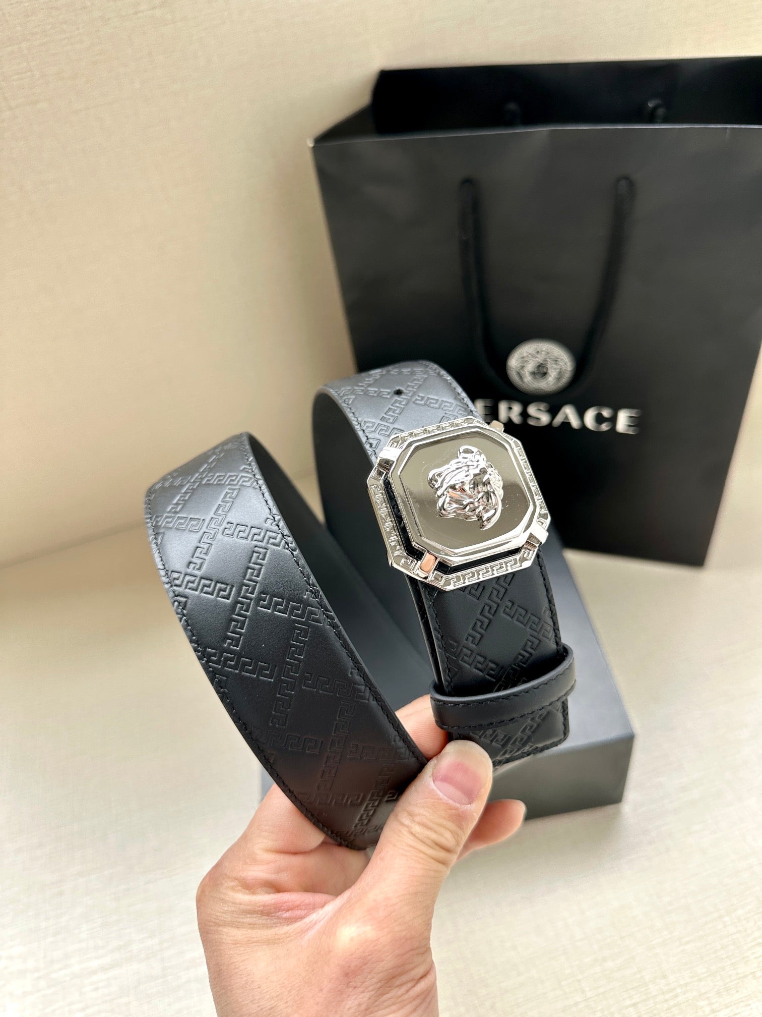 Versace belt, dark patterned leather with gold lion medallion buckle