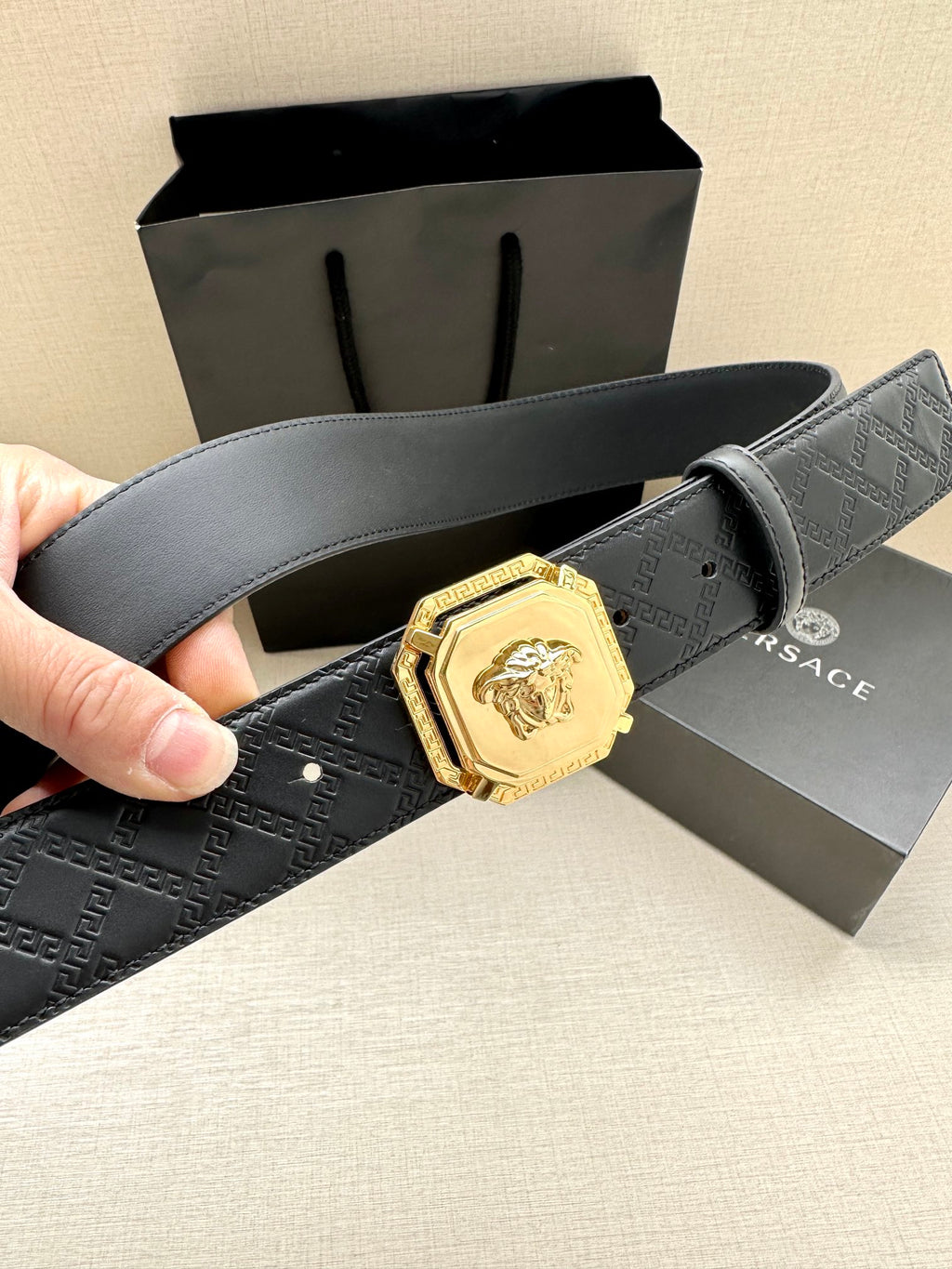 Versace belt, dark patterned leather with gold lion clasp buckle and cut strap end