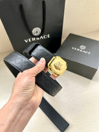 Versace belt, dark patterned strap with gold lion medallion buckle