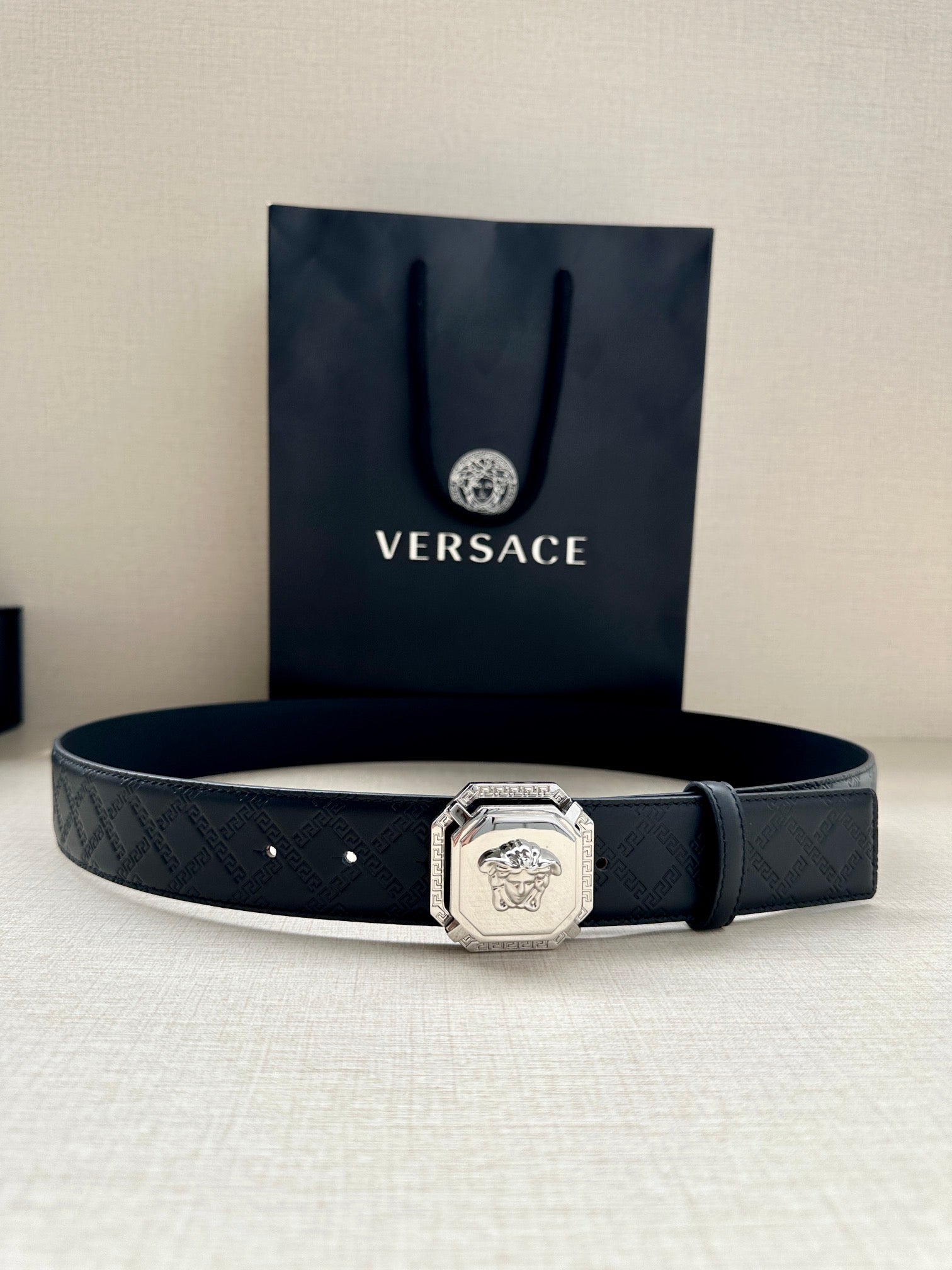 Versace belt, dark patterned leather with silver lion medallion buckle