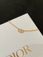 Gold-tone chain necklace with oval link and small pave pendant