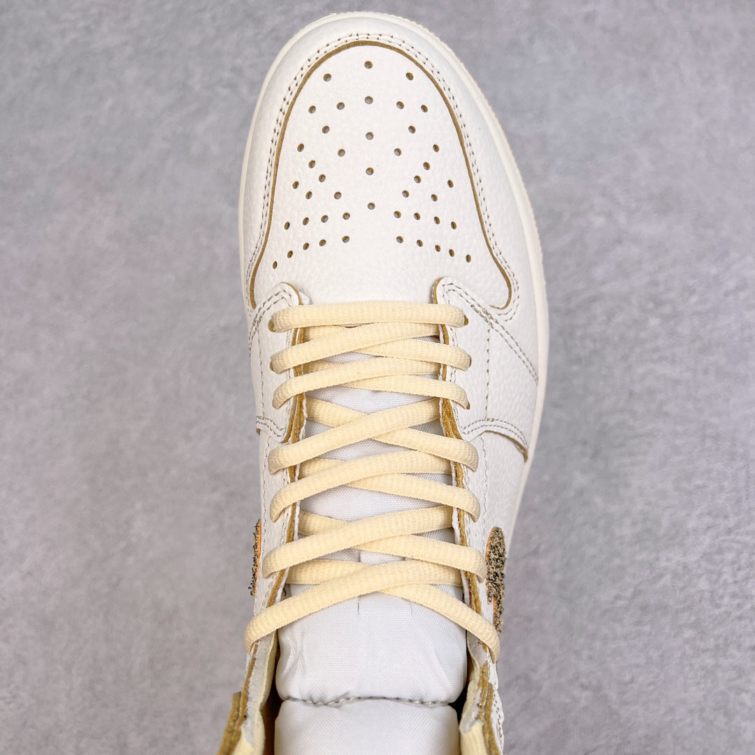 White high-top sneaker with perforated toe box and cream-yellow lace pattern.
