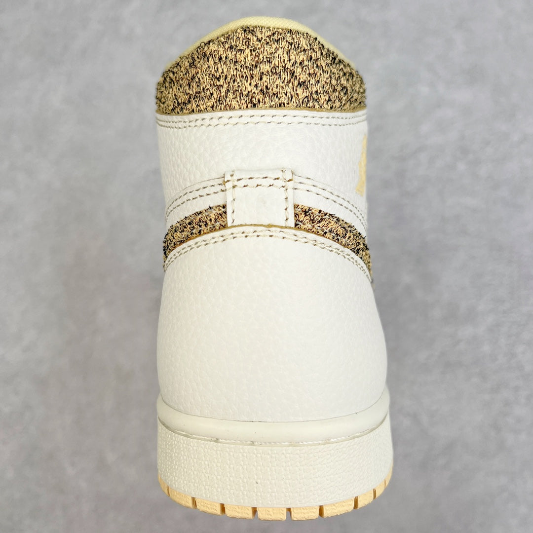 Back view of white high-top sneaker with brown speckled collar and padded heel.