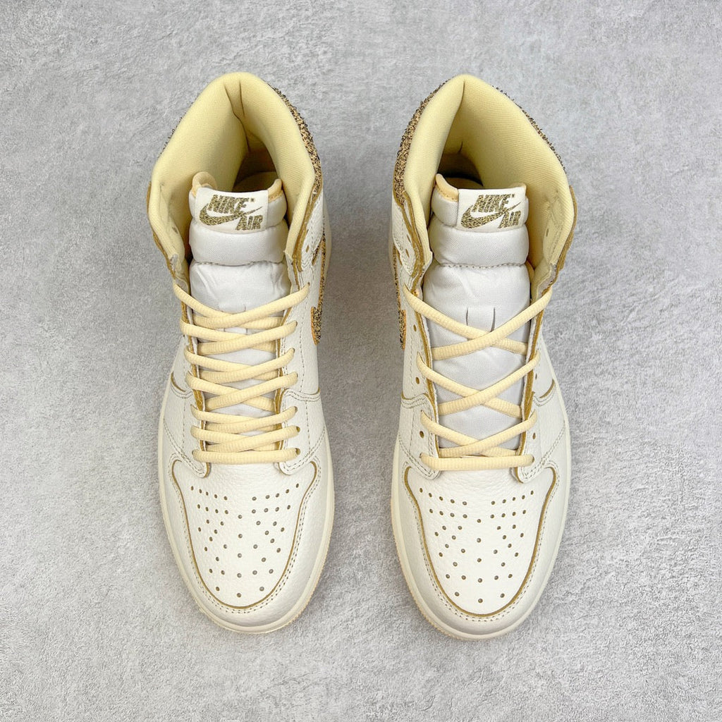 Pair of white high-top sneakers with yellow laces, tan lining, and speckled side panels.