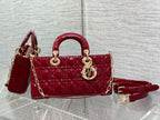 Dior handbag deep red quilted, top handles, gold chain strap.