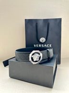 Versace belt with embossed strap and lion medallion buckle on box