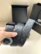 Dark navy patterned belt strap with circular buckle end and visible stitching