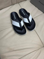 Black and white flip-flop sandals with thong strap and cushioned footbed