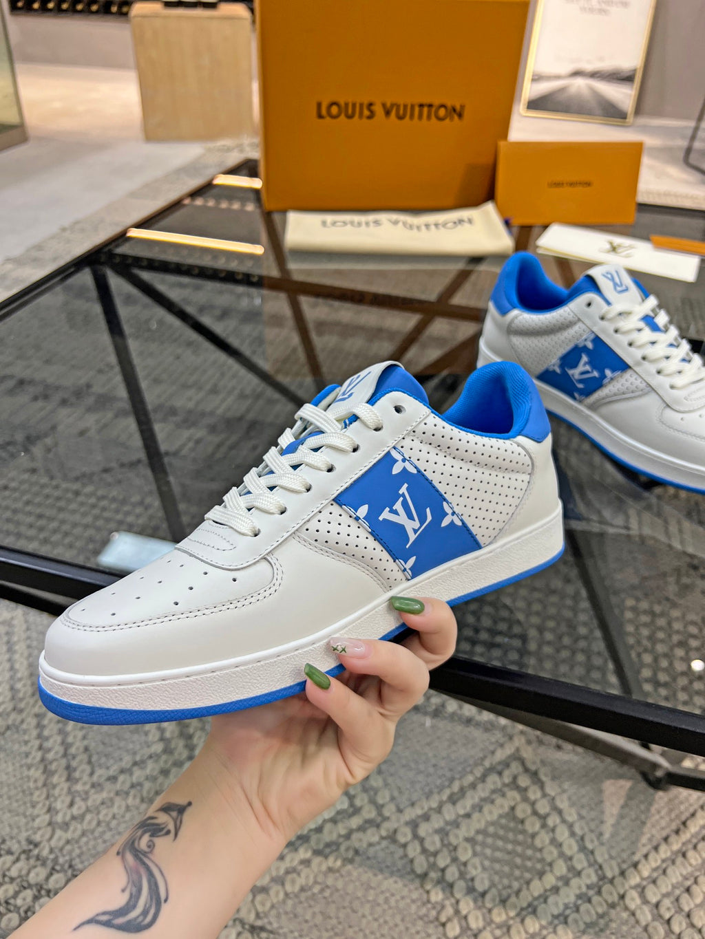 Louis Vuitton low-top sneakers, white leather with blue accent sole and lace-up front
