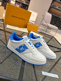 Louis Vuitton low-top sneakers, white leather with blue logo panels and blue sole