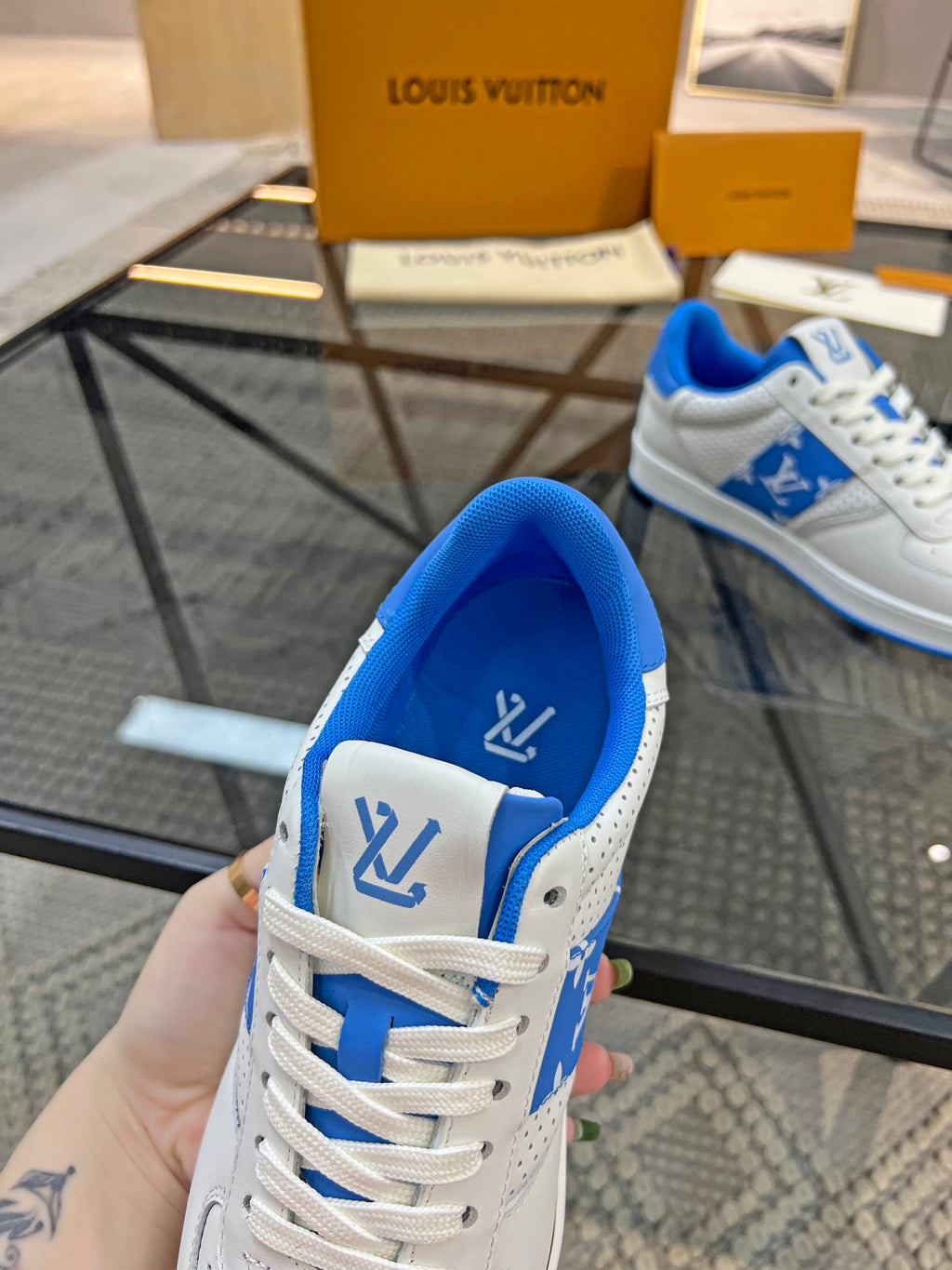 Louis Vuitton low-top sneaker, white upper with blue collar lining and lace-up