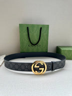 Gucci belt with dark gray GG canvas and gold-toned logo buckle