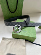 Gucci belt with dark gray GG canvas strap and large silver-toned logo buckle